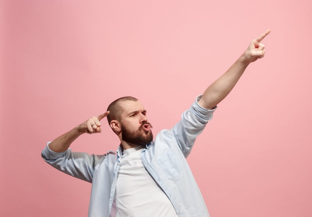 Winning success man happy ecstatic celebrating being a winner. Dynamic energetic image of male model