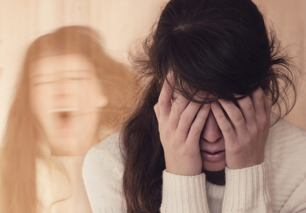 Emotional portrait of woman suffering from mental disorder (schizophrenia or Dissociative identity disorder)