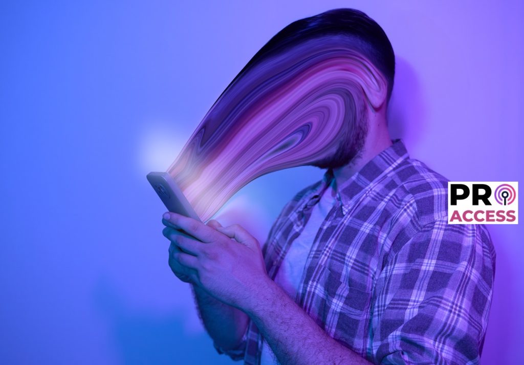 Smartphone and social network addiction concept. Face absorbed by use of smartphone