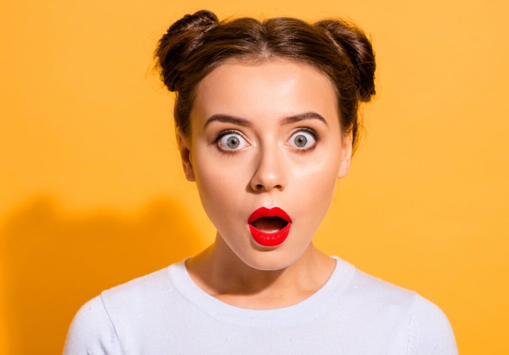 Close-up portrait of her she nice attractive lovely puzzled girl opened mouth stunning news isolated over bright vivid shine yellow background
