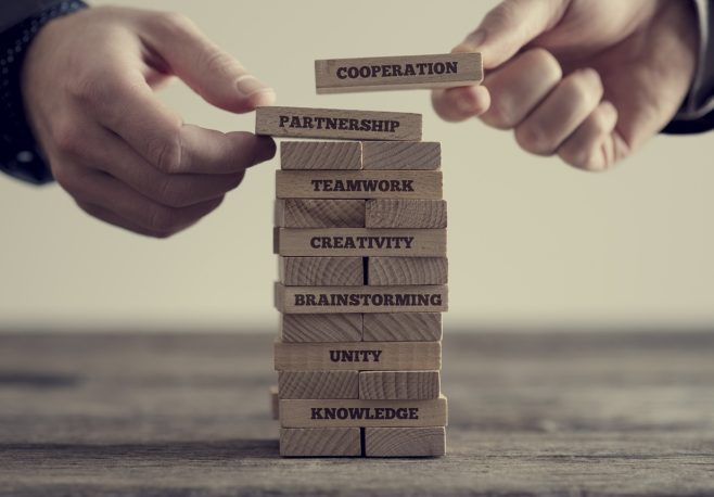 Stack of wooden dominoes with signs