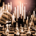 Chess game on chess board on stock market or forex trading graph chart for financial investment concept. Economy trends for digital business marketing strategy analysis. Abstract finance background.