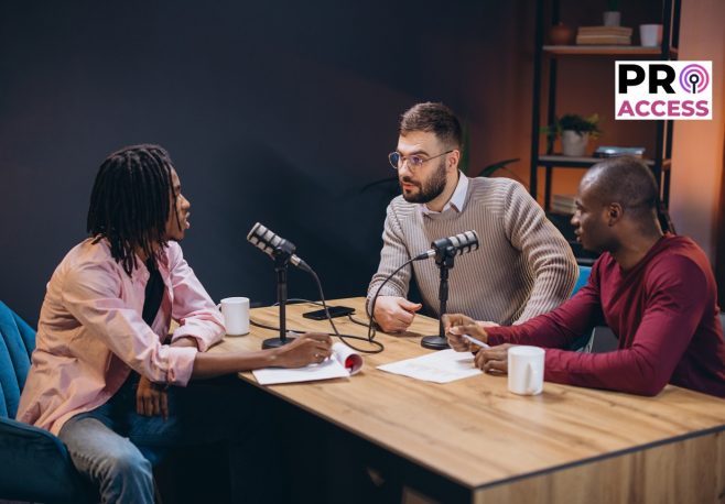 Three radio hosts interviewing a guest in a professional podcast studio, engaging in a discussion and creating audio content