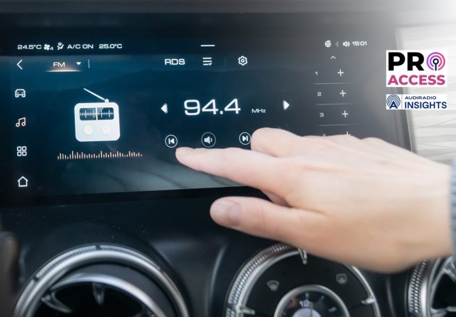 The passenger controls the radio on the car's touchscreen with his finger. An individual adjusts the radio on a sleek car dashboard touchscreen, highlighting convenience and technology.