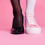 Cropped close-up view image concept photo of two different fit thin slim legs cozy comfort luxury luxurious elegant chic sporty comparison footgear isolated on pink pastel background