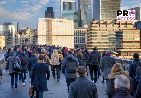 Crowds of commuters on London Bridge rushing into the City