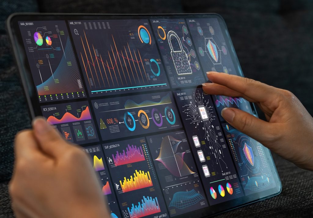 Analyst use laptop working with business analytics and data management system, make a report with KPI and metrics connected to database.Corporate strategy for finance, operations, sales, marketing